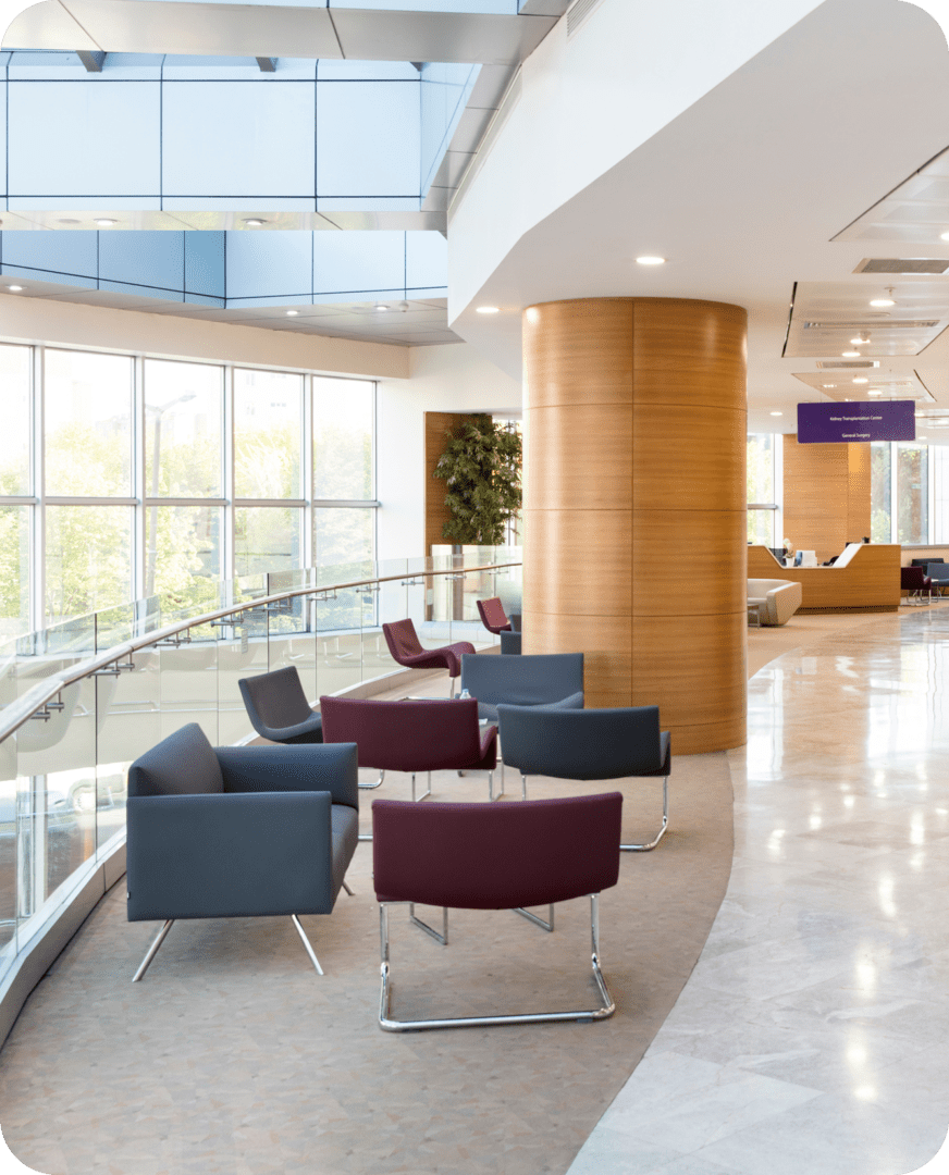 Contemporary lobby featuring large windows and chairs
